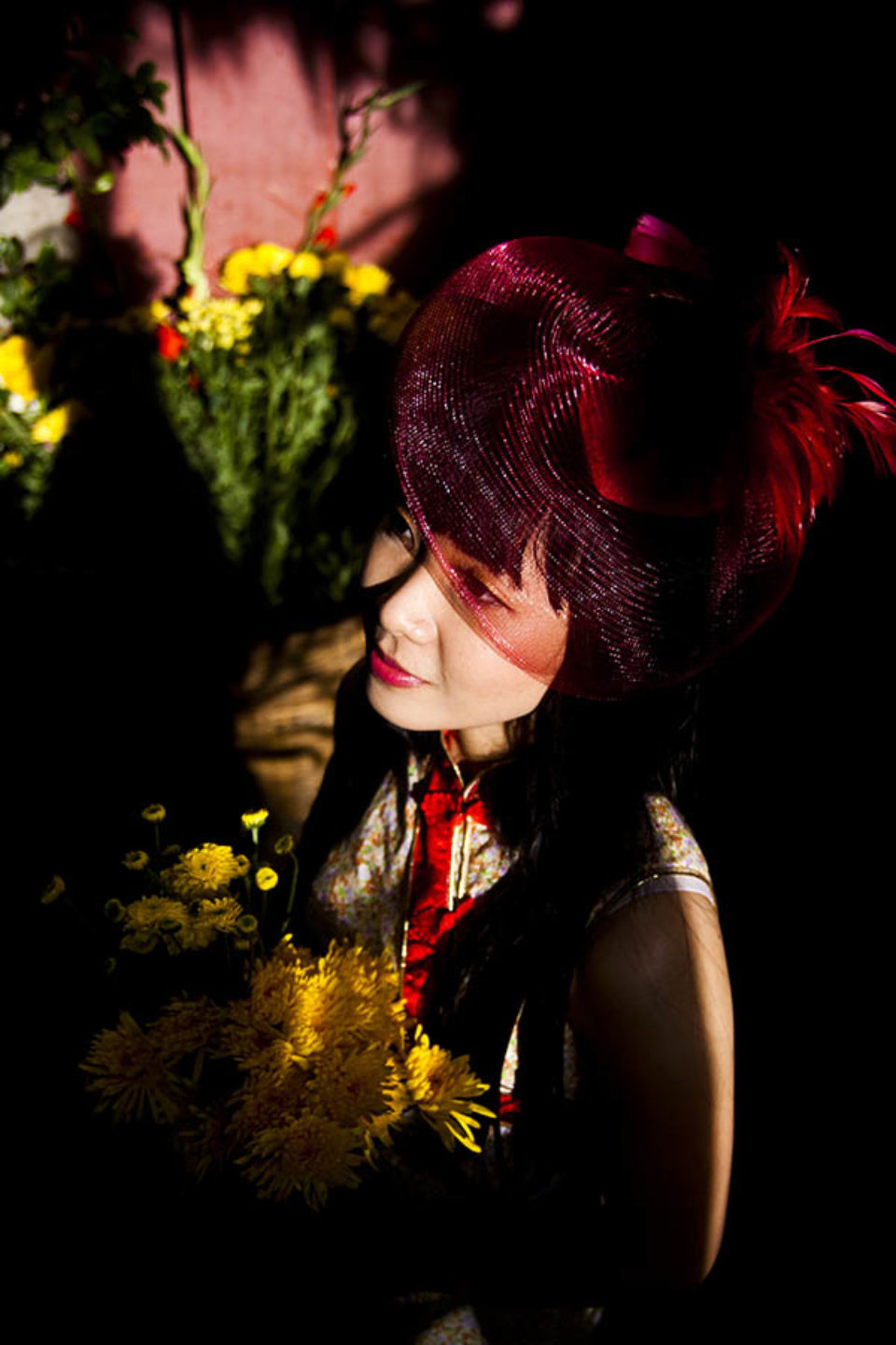 young woman in hat in temple sunlight