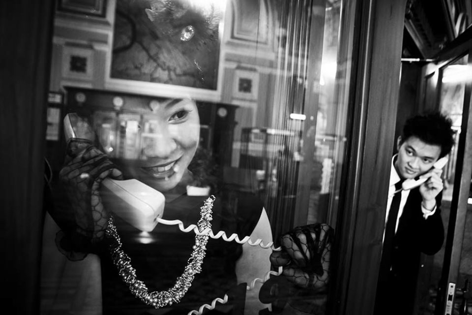 couple talking on telephone