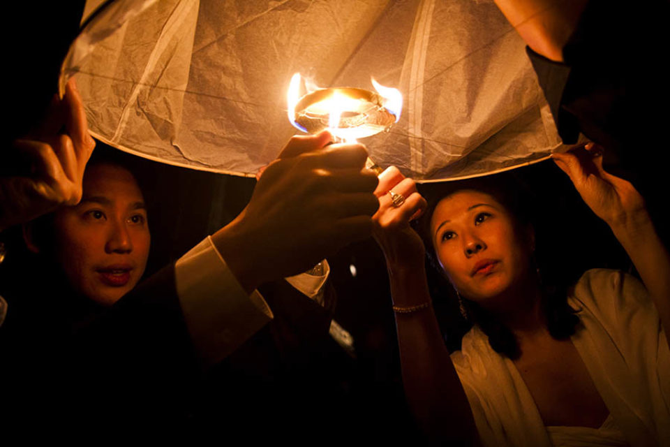Husband and wife light lantern