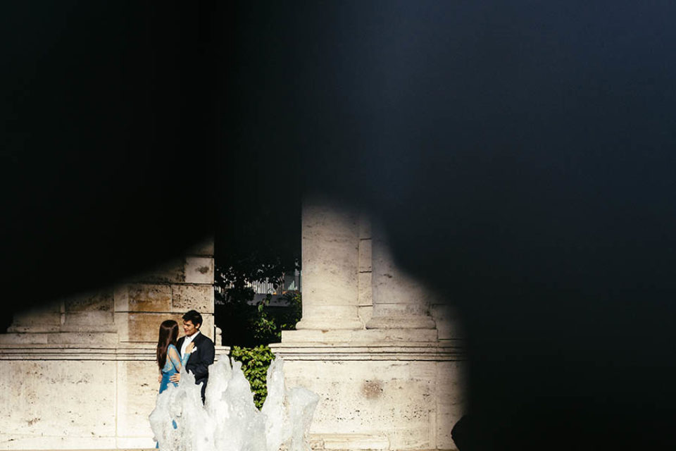 Couple portrait by fountain