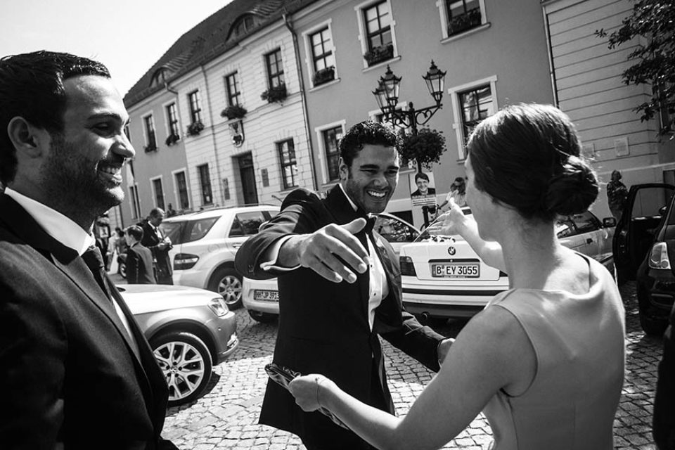 Groom greeting family members