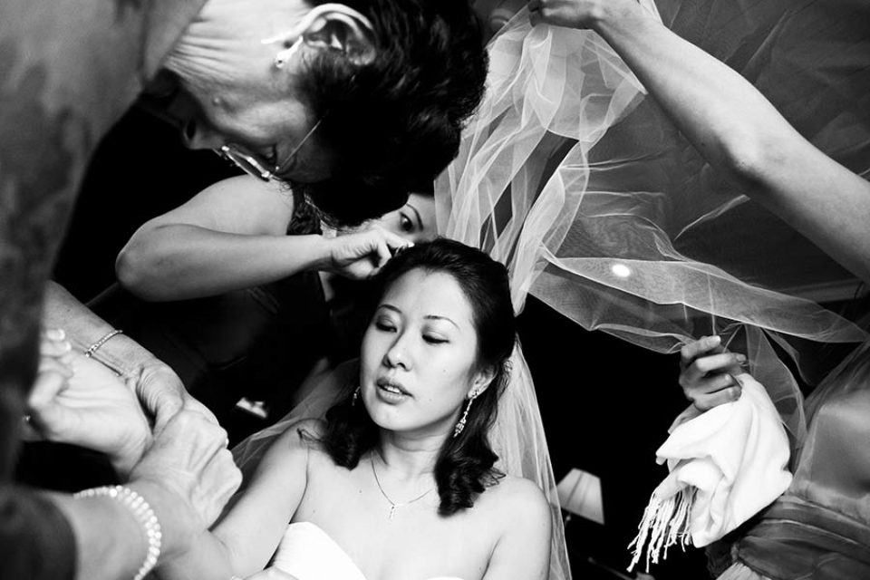 Bride being prepared for her wedding