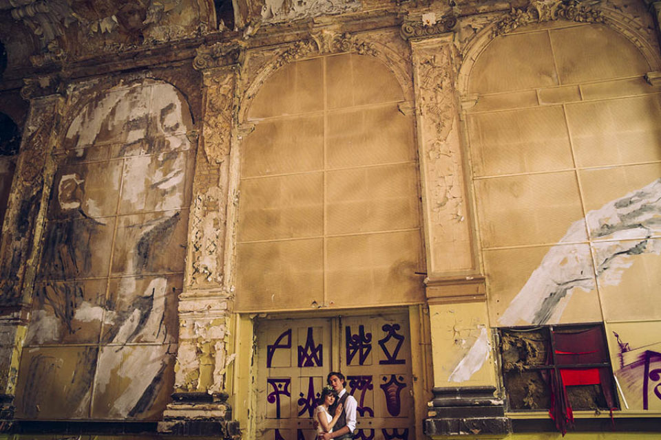 Couple shoot in abandoned ballroom