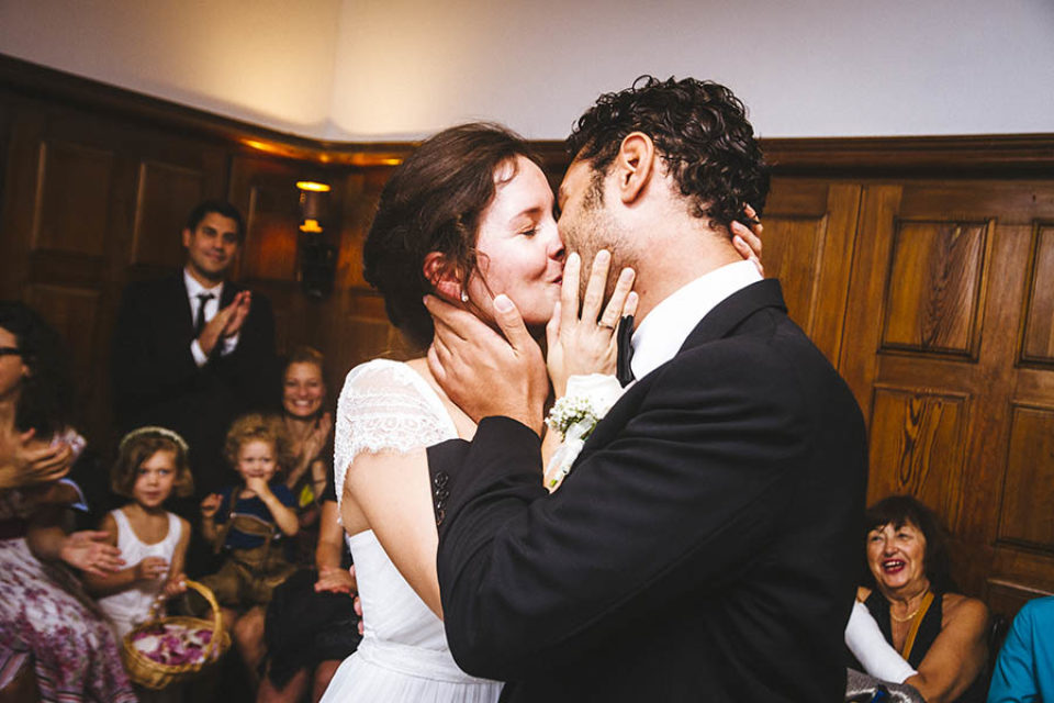Bride and groom share first kiss