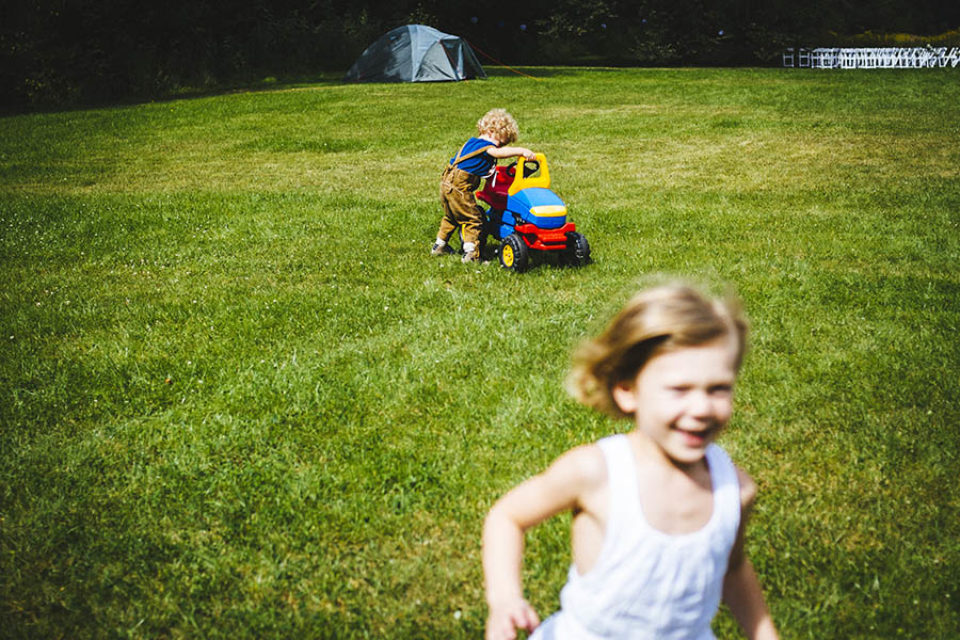 Children play in wedding reception garden