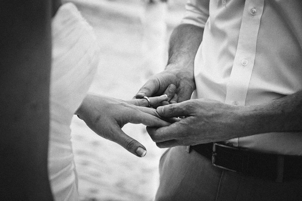 Exchanging rings during wedding ceremony