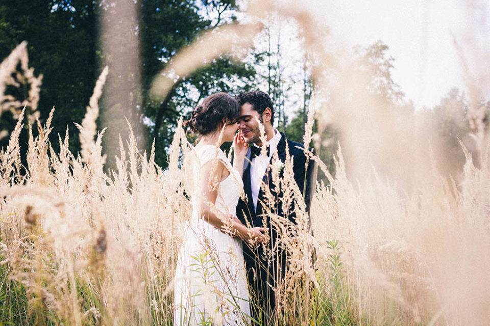 Newlyweds in long grass