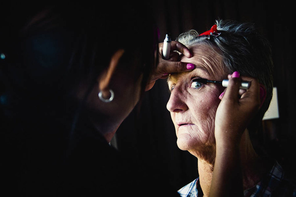 Woman having mascara applied