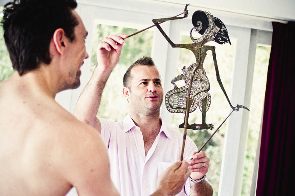 Best men playing with Balinese shadow puppet