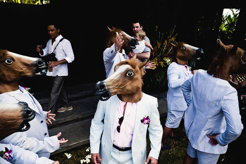 Best men wearing horses heads
