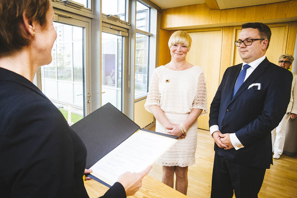 Bride and groom during registry office wedding ceremony