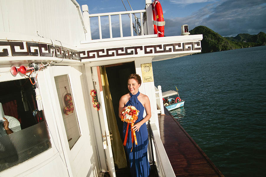 Bride on boat coming to her wedding ceremony