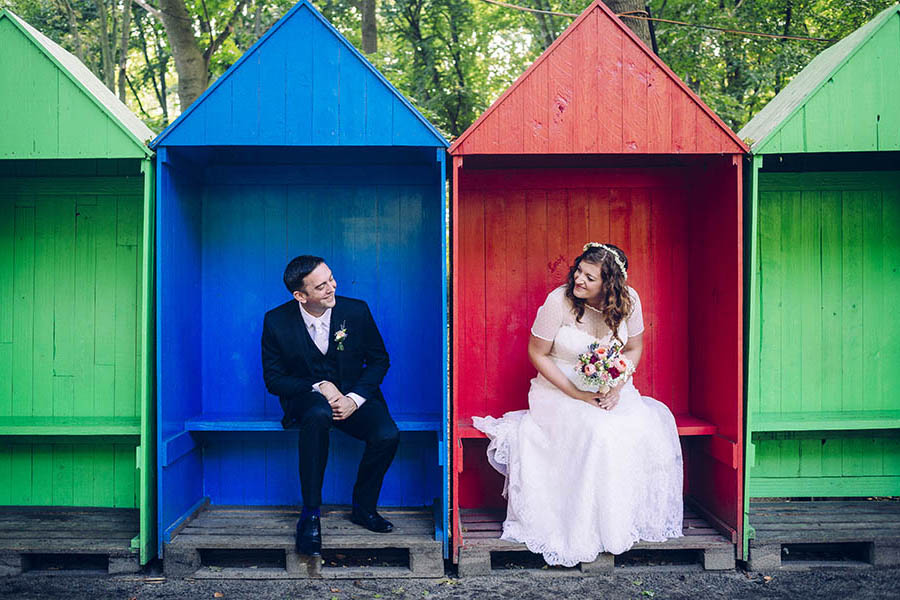 engagement photographer - bride and groom portrait in coloured huts