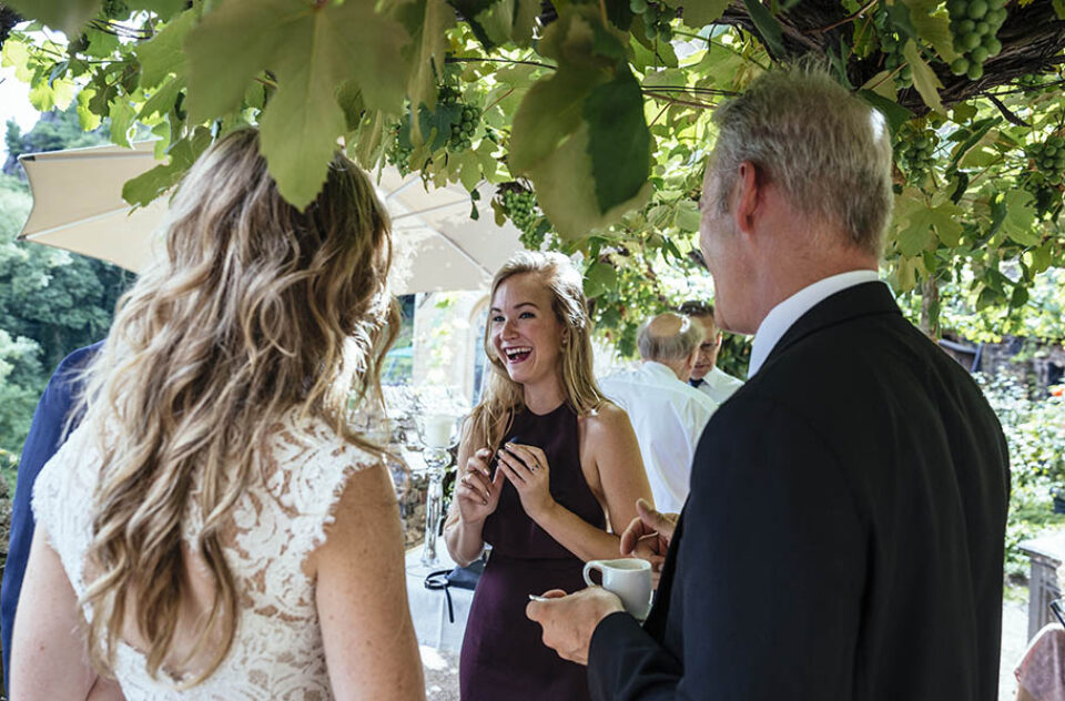 Wedding guests laughing