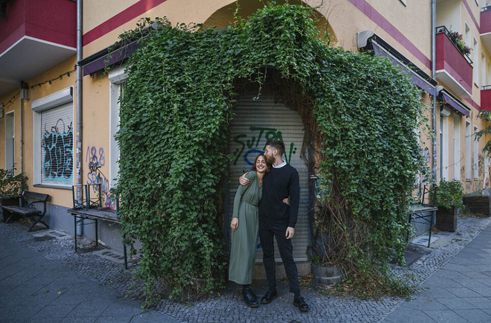 Couple in leafy doorway