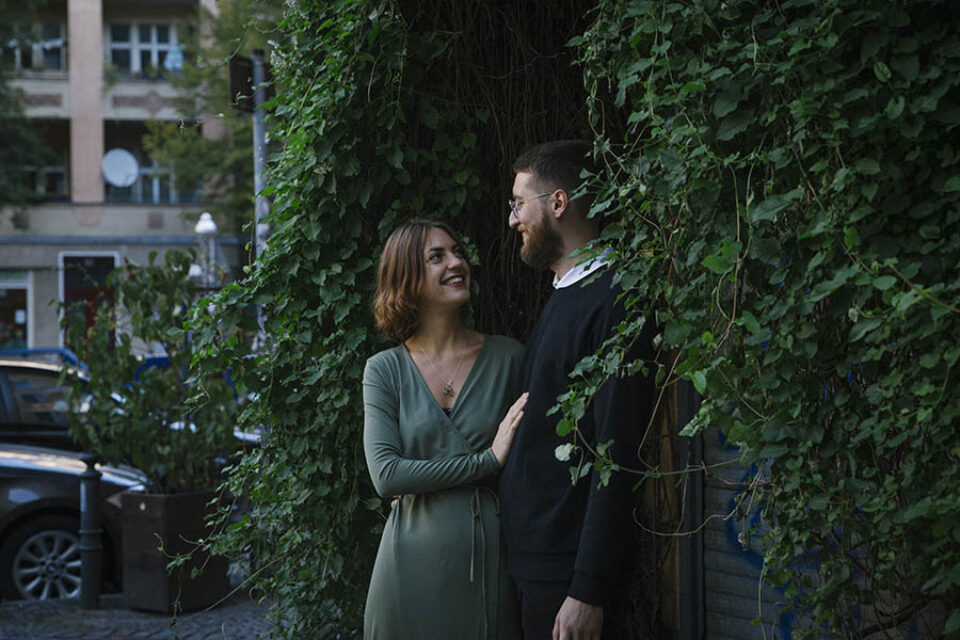 Happy newlyweds in leaves