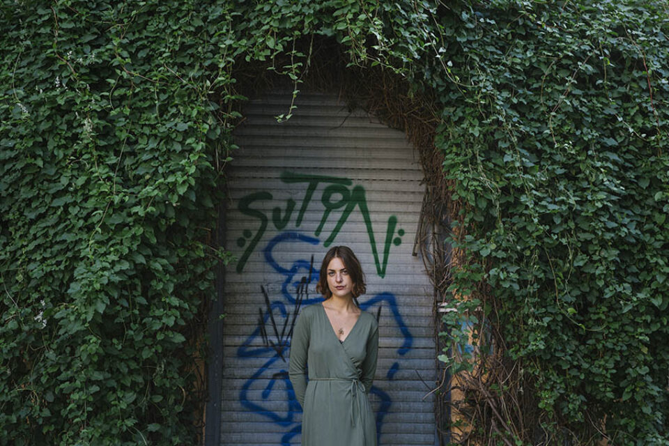 Woman green dress green leaves