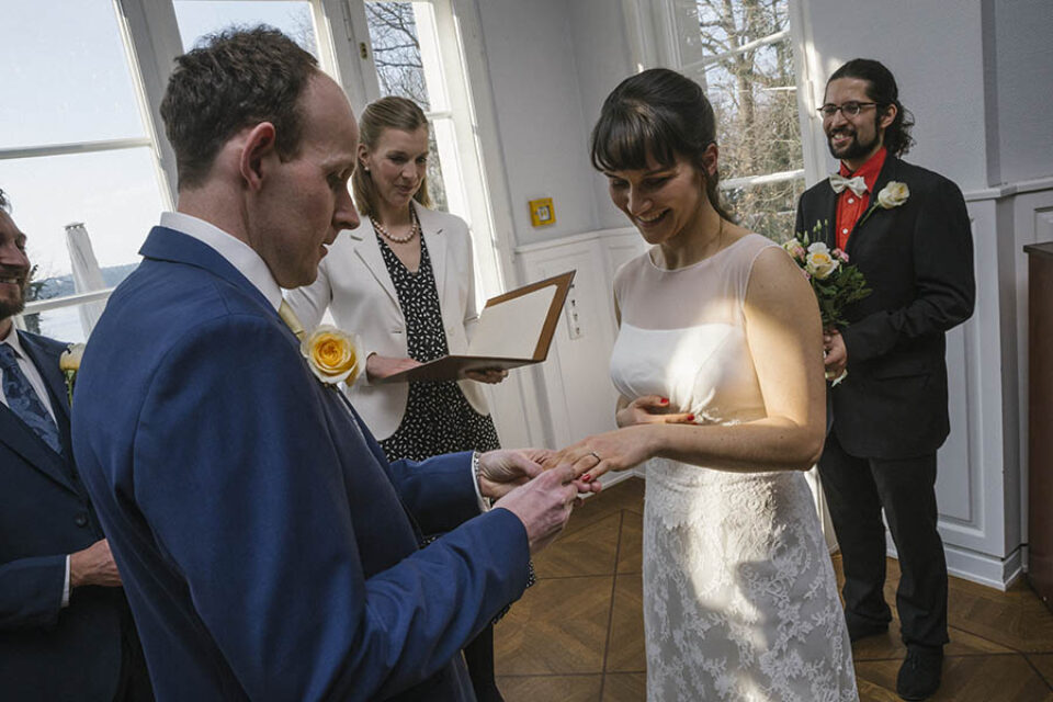 Bride receiving wedding ring