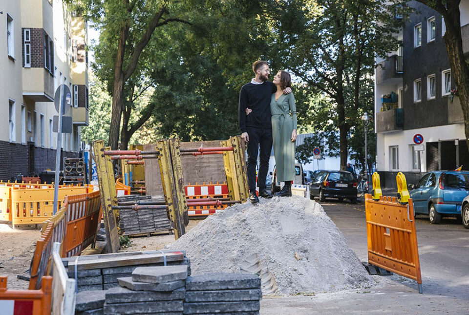 Couple portrait Neukolln constructinon site sand