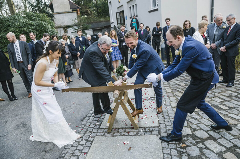 Traditional Bavarian wedding log sawing