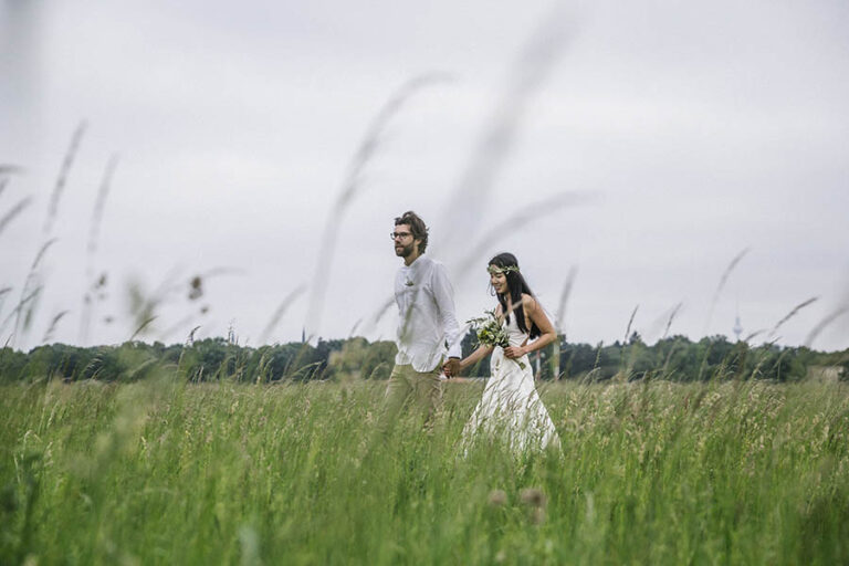 Couple walk in long grass