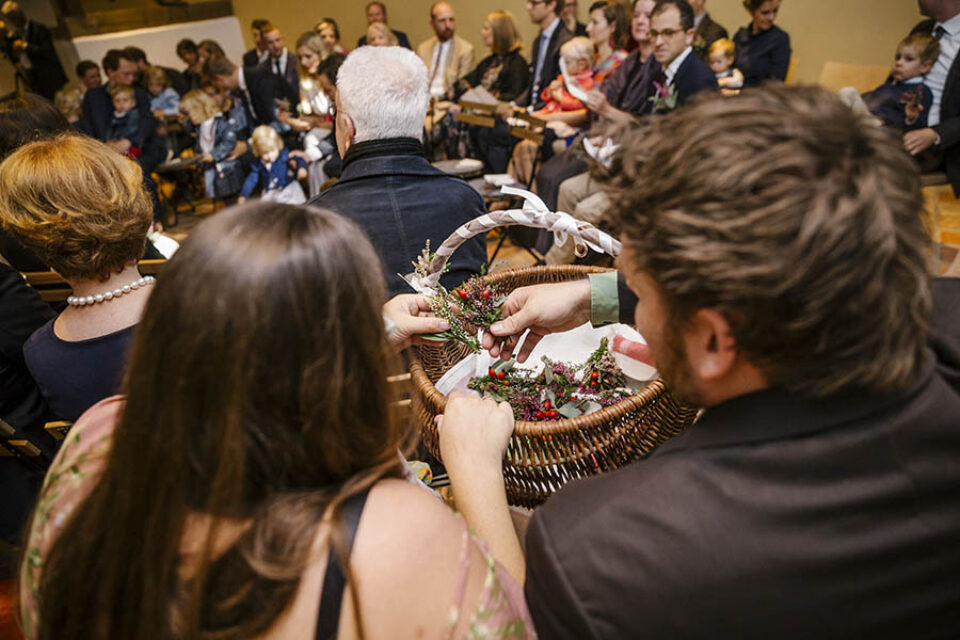 Wedding guests put wildflowers in basket