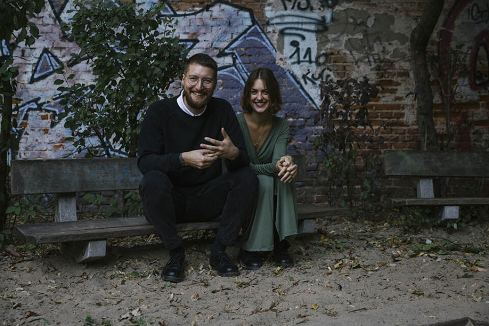 Happy couple graffitied playground