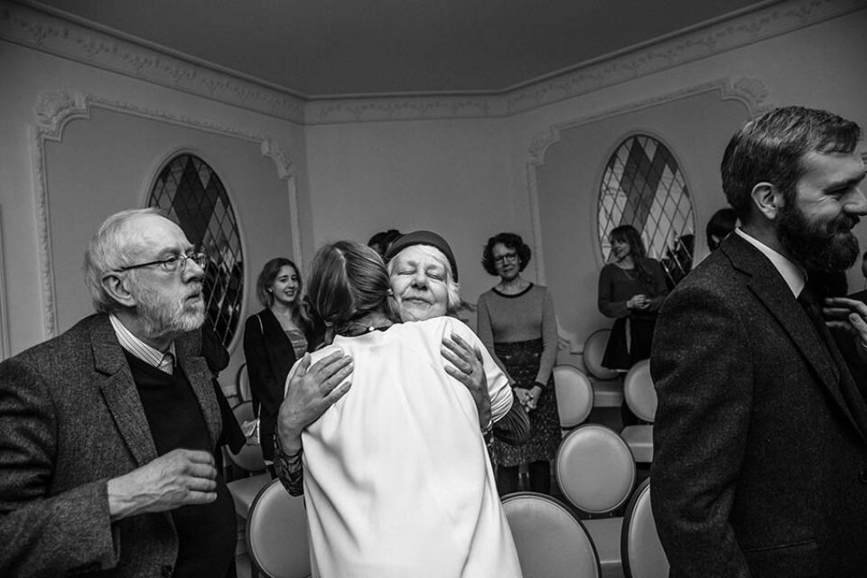 Family members congratulate bride after wedding