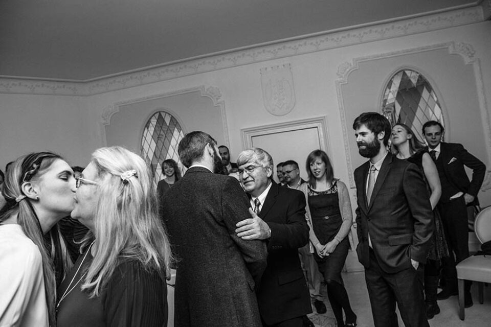 Family congratulating newly married couple