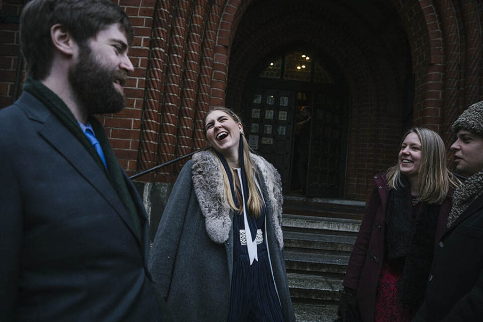 Bride laughing with wedding guests