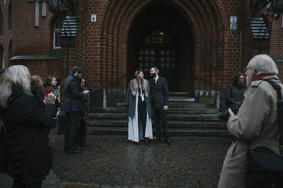 Newly married couple outside Rathaus Kopenick Berlin