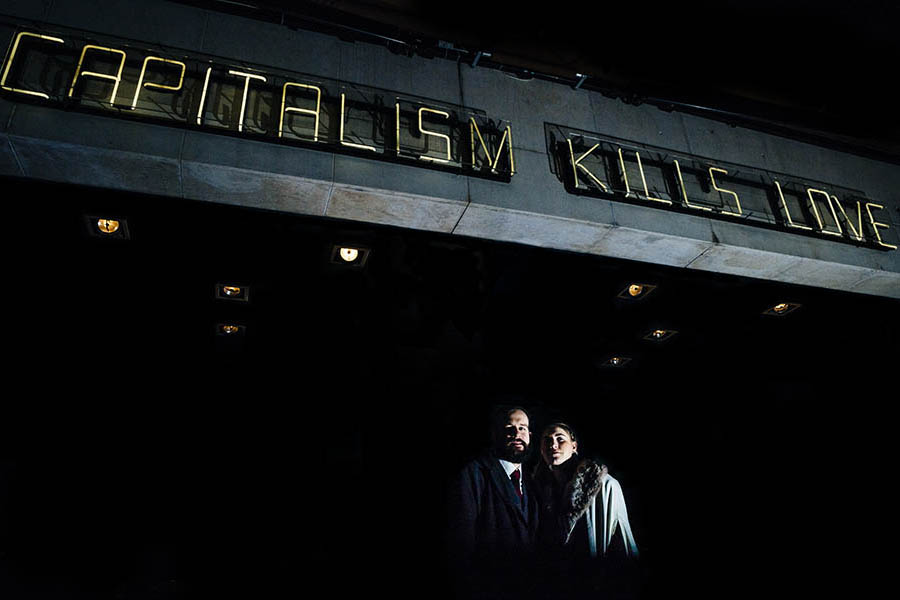 Couple portrait under neon sign