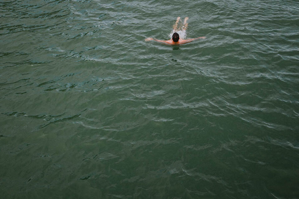 The groom goes for a swim