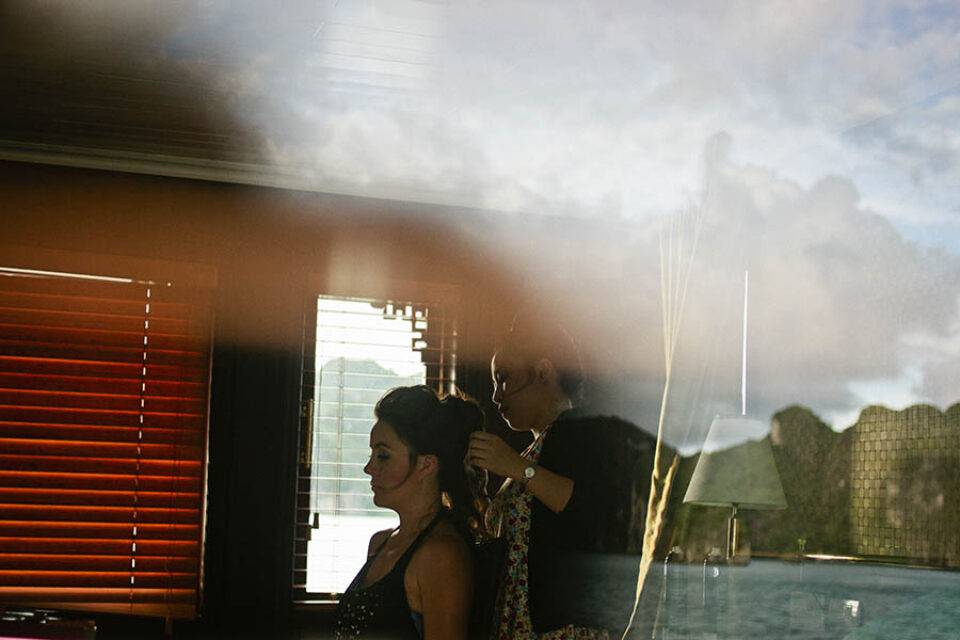 Bride preparing with Halong Bay reflection