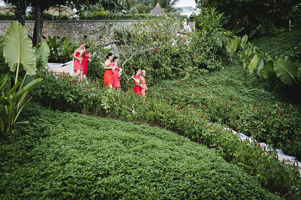 Bridesmaids walk down stairs