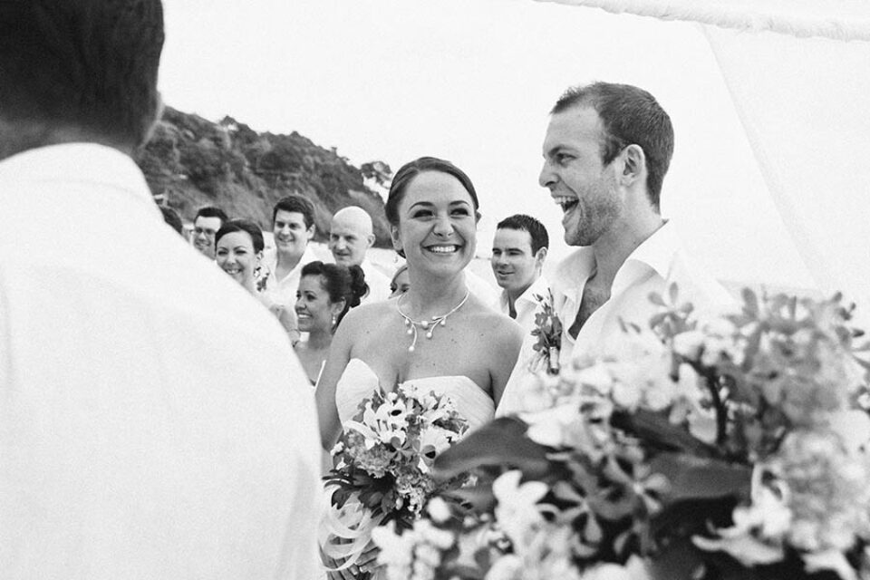 Bride and groom laughing during wedding