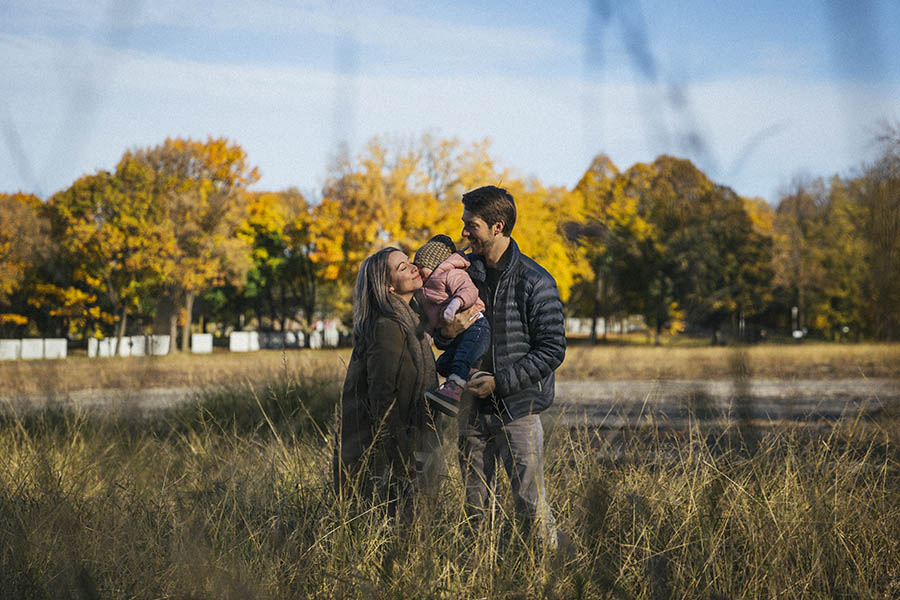 Montreal Family Photographer - Happy family in long grass in autumn