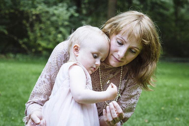 Mother and toddler with daisies