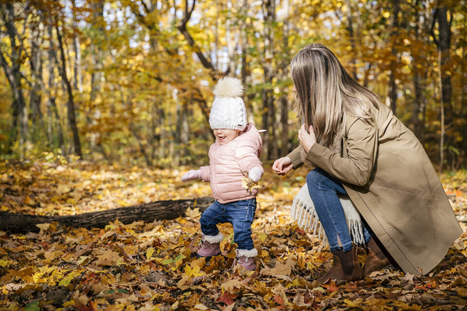 Toddler playing with mother