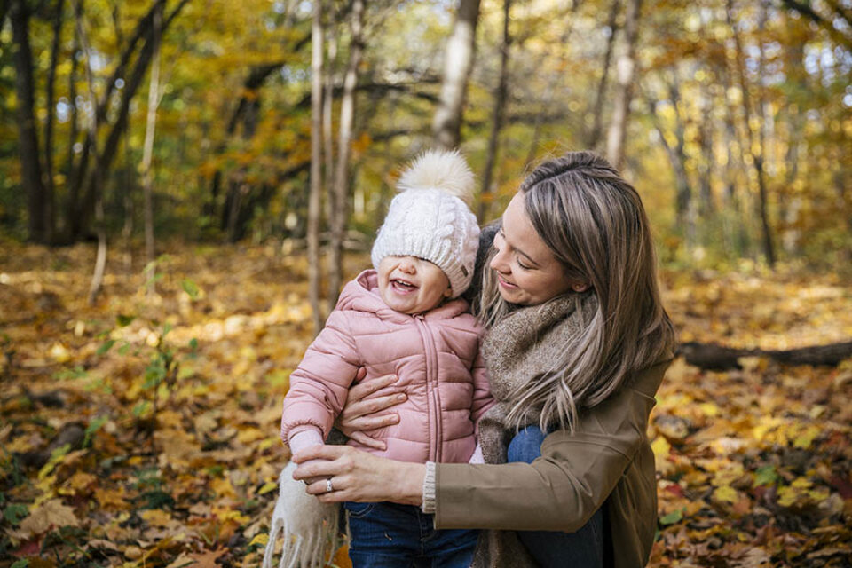 Mum and toddler laughing