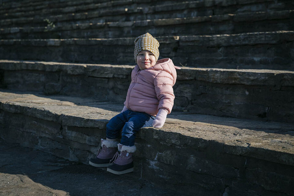 Toddler sitting on steps