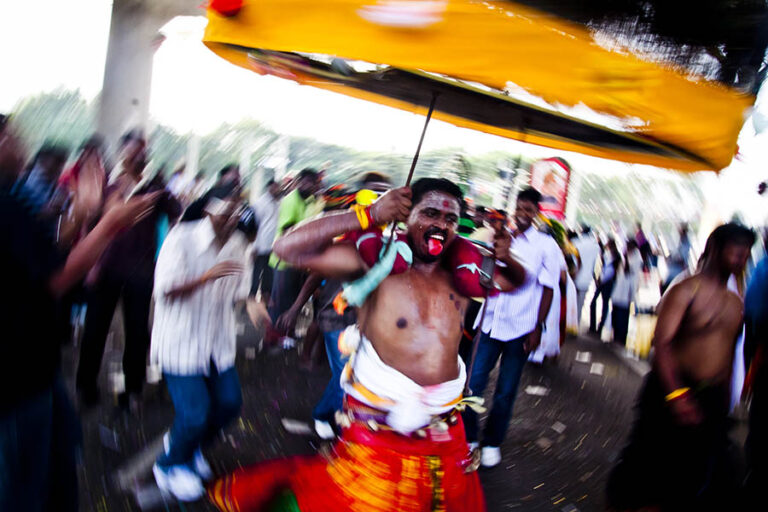 Thaiphusam celebrant dancing with kavadi