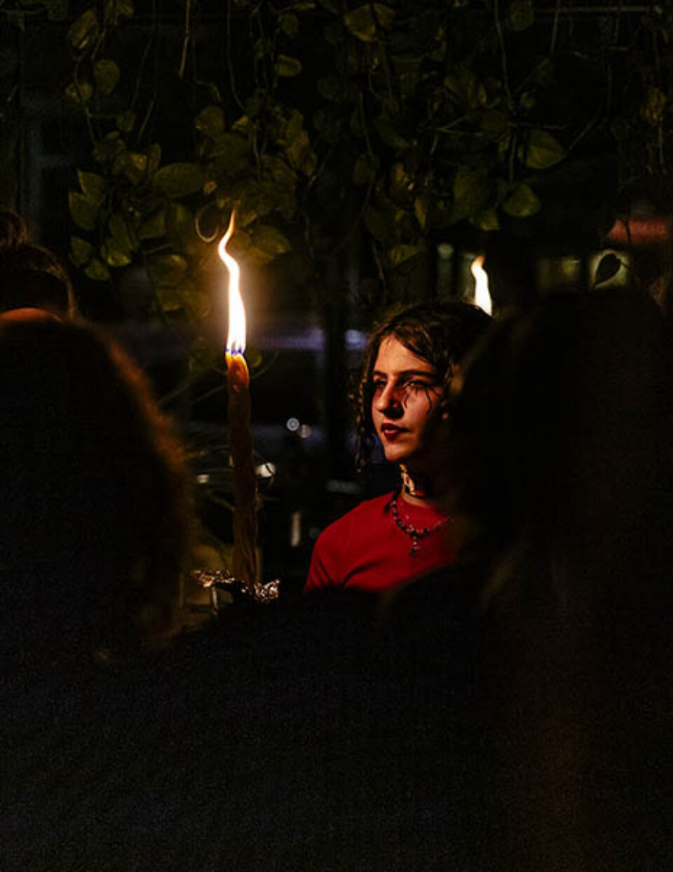 Young woman holds Havdalah candle